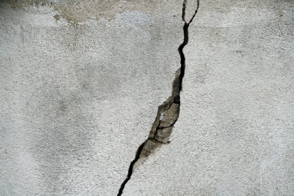 big crack in concrete slab, cracks in concrete, cracks in foundation