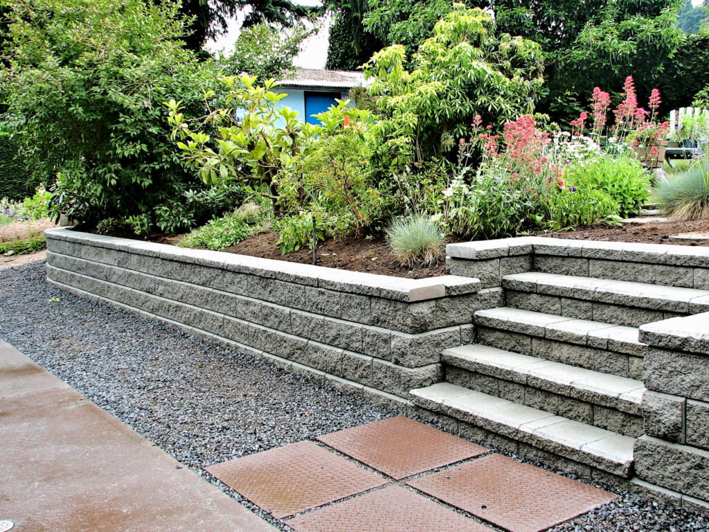 Hardscaping, firepit, fire pit, outdoor kitchen, stamped concrete, concrete patio, patio, paved patio, retaining wall